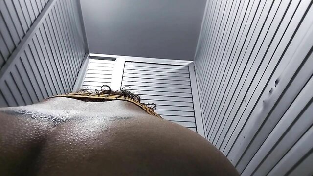 Hidden camera captures big ass in public bathroom at airport