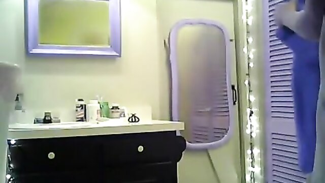 Small breasted girl with purple hair stripping in the bathroom